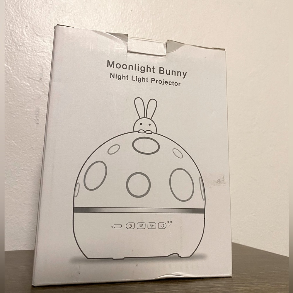 Night light projection in room with blue tooth music player